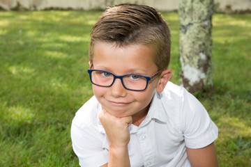 young boy child funny with his glasses