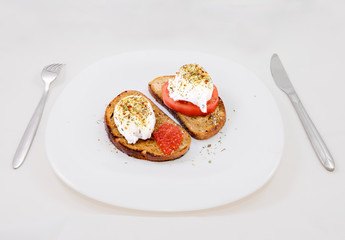 Egg poached with red caviar and tomato