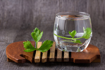 water in glass old wood background