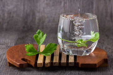 water in glass old wood background