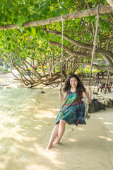 Obraz premium portrait of beautiful Asia woman wearing long dress on the beach and for people vacation in paradise destination