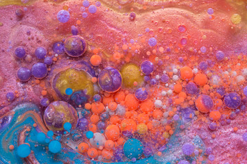 Colourful and beautiful effect of water paint and oil mixing. Multicoloured abstract bubbles.