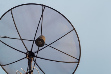 Satellite dish communication network and blue sky.