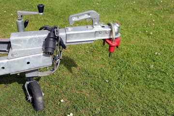 Trailer hitch and jockey wheel, with electric hook up and hitch lock, in sunshine