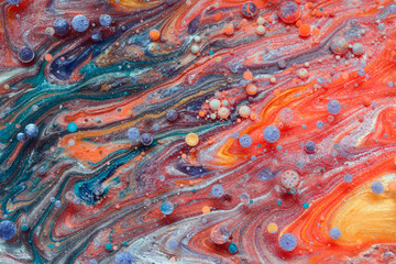 Colourful and beautiful effect of water paint and oil mixing. Multicoloured abstract bubbles.