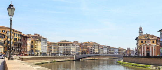 Fototapeta na wymiar Pisa - historic townhouses along the Arno embankment