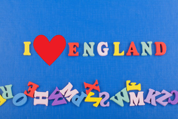 I love ENGLAND word on blue background composed from colorful abc alphabet block wooden letters, copy space for ad text. Learning english concept.