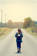 Women walk alone on the street.