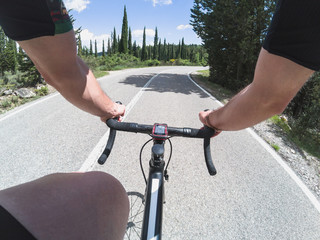 Fototapeta na wymiar Cyclist training on a racing bicycle. POV