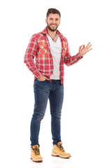 Man In Unbuttoned Lumberjack Shirt Is Showing Ok Hand Sign