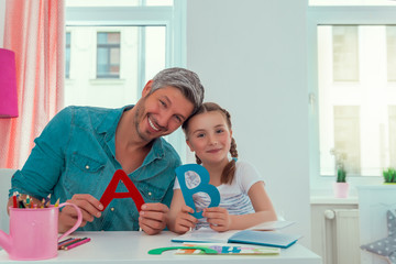 father with daughter preparing preschool alphabet © detailblick-foto