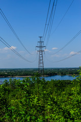 High voltage power line against sky