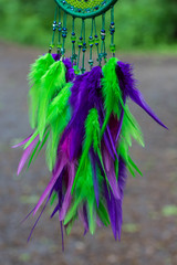 Dreamcatcher made of feathers, leather, beads, and ropes