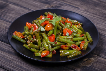 Healthy green beans, red cherry tomato with sesame seeds