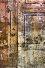 Altes Mauerwerk mit verblassten Farben als Hintergrund