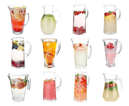 Different drinks in glass jugs on white background. Ideas for summer cocktails