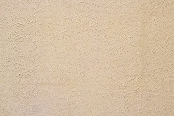Wall plaster. Beige plastered background in natural light. Horizontal.