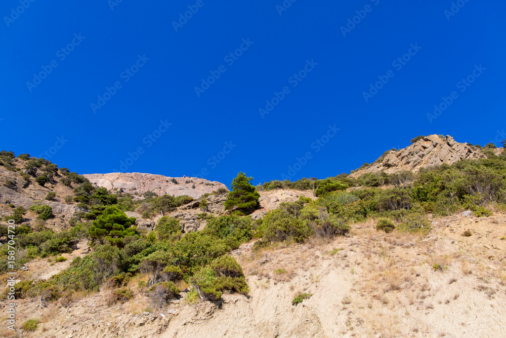 Wall mural mountain landscape on the blue sky background