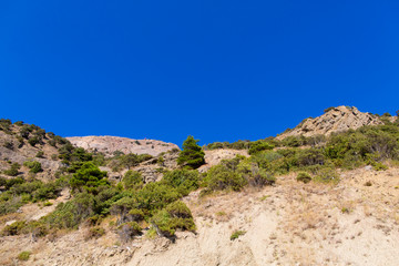 Mountain landscape on the blue sky background 
