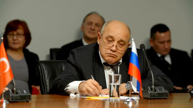 The representative of Russia listens to suggestions for combating terrorism