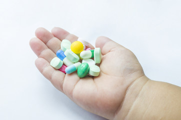 pill in a hand isolated on white background