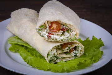 Pita bread wrapped with cottage cheese and vegetables