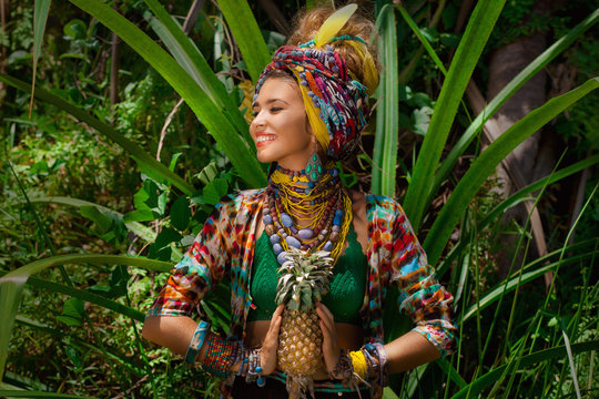 attractive boho woman outdoors at jungle background