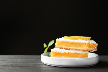 Delicious lemon pie bars on dark background,copy space text