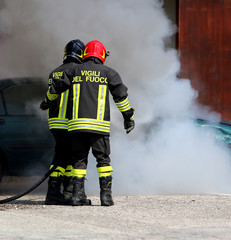 Italian fire brigade with the letter on the uniform meaning fire