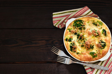 Broccoli baked with egg and cheese. Copy space
