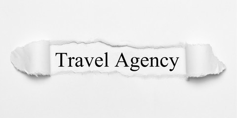 Travel Agency on white torn paper