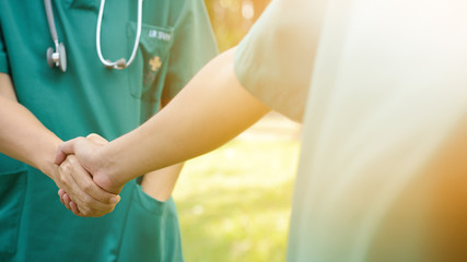 Two surgeon people medical handshaking