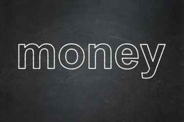Money concept: Money on chalkboard background