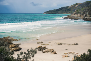 View of the pristine beachfront at North Point, Moreton Island during the day.