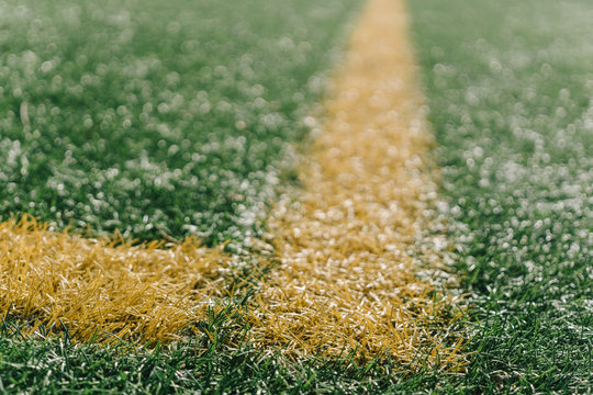 Yellow corner on sports field with artificial grass