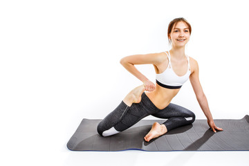 Fototapeta premium Woman doing exercises on mat