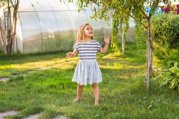 cute little girl in spring or summer day