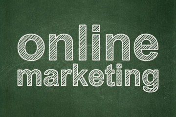 Advertising concept: Online Marketing on chalkboard background