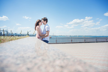 Loving couple on the sea pier