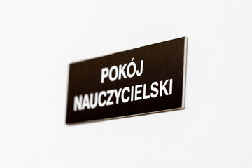 School staff room label on closed door in Polish school