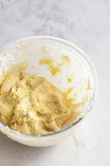 MIxing baking ingredients in a bowl for cake or pancakes. Light food photography concept