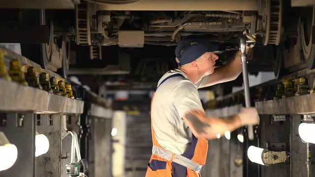 a man repairing a train