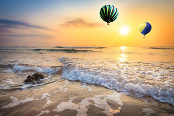 Fototapeta na wymiar Hot air balloon over the beach in summer morning, Thailand