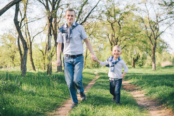 father with son playing in the park