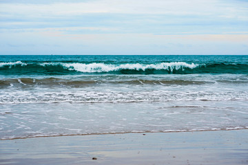 sand beach with blue ocean