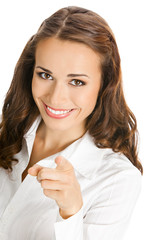 Businesswoman pointing finger at viewer, on white