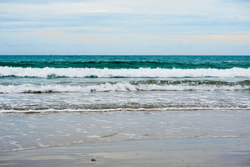 sand beach with blue ocean