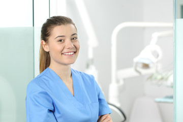 Female doctor posing in a dentist office