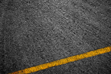 Fototapeta premium Asphalt background texture with some fine grain with Yellow Stripe