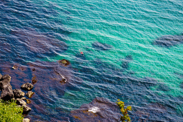 Rocky beach at the foot of the mountain